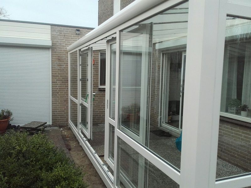 Aluminium veranda met glasschuifdeuren - Alphen aan de Rijn Aluminium veranda met glasschuifdeuren - Alphen aan de Rijn
